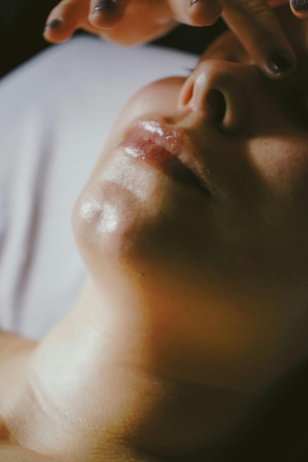 Gentle touch during a facial treatment at the clinic